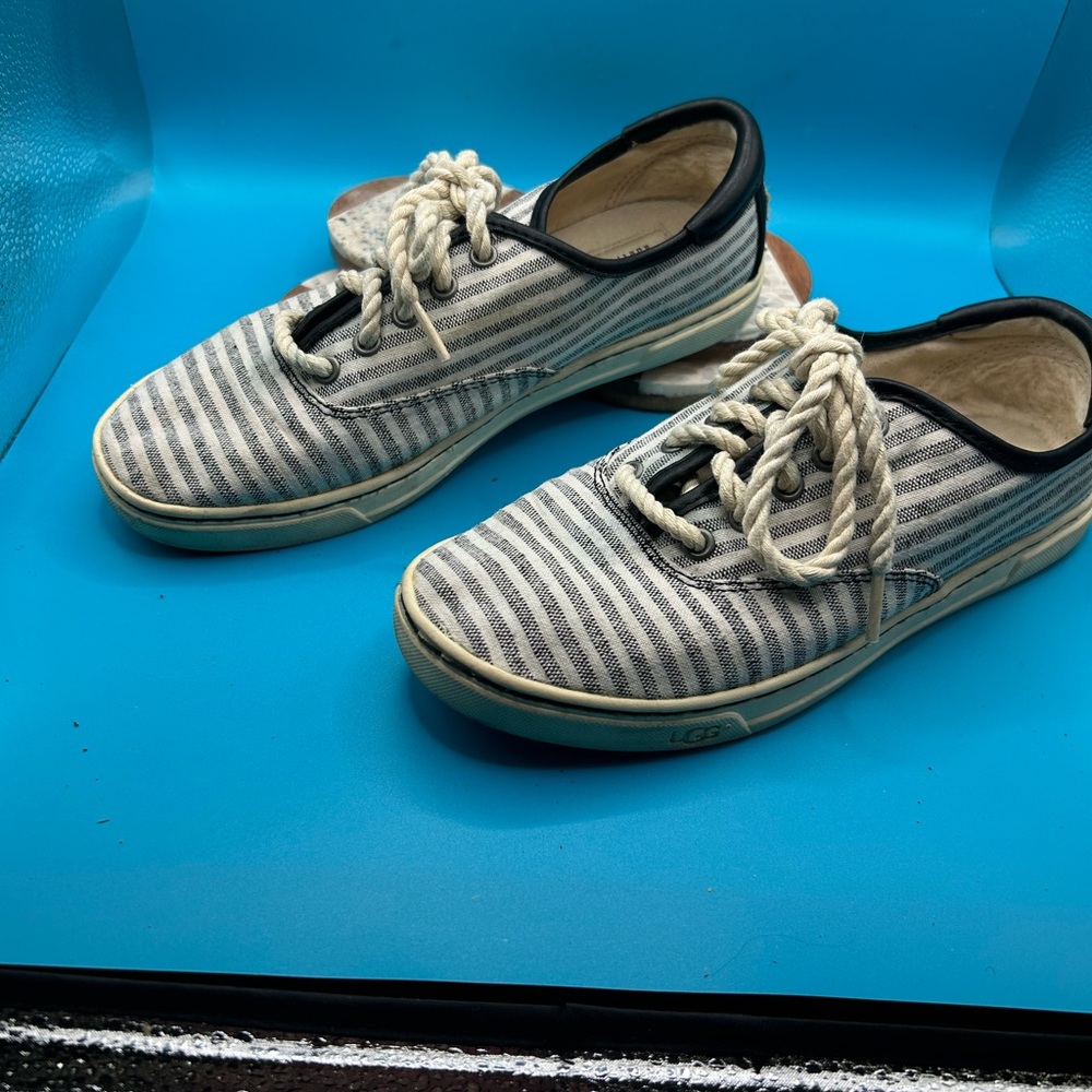 UGG  gym shoes with twisted shoe laces.